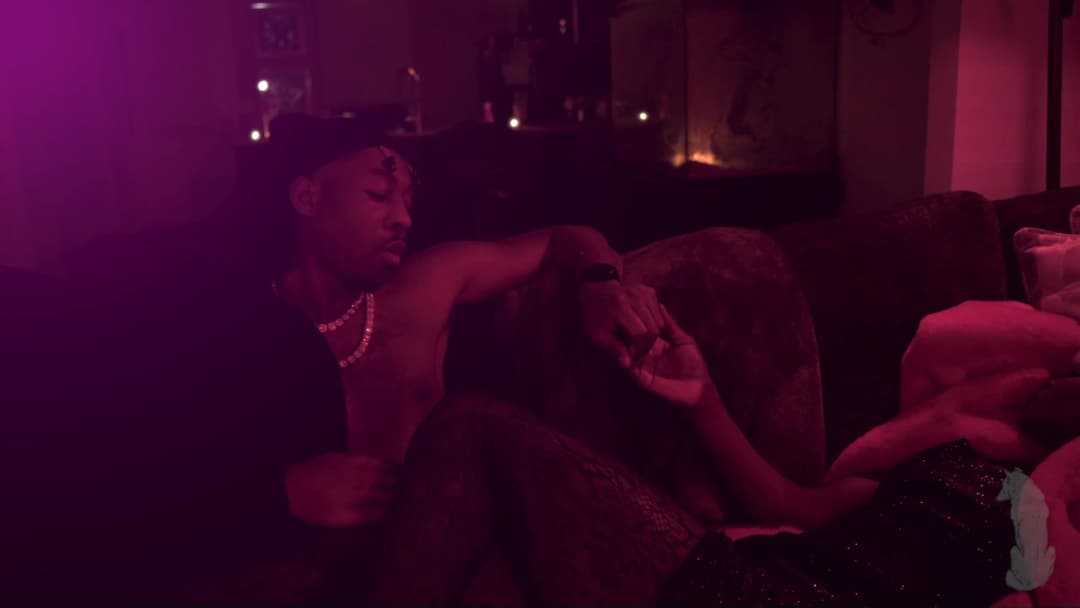 Pain music video still — datamoshed frame 012