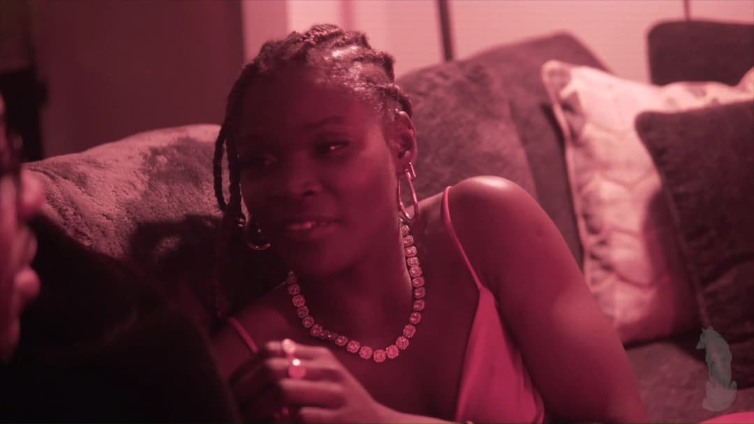 Pain music video still — datamoshed frame 014