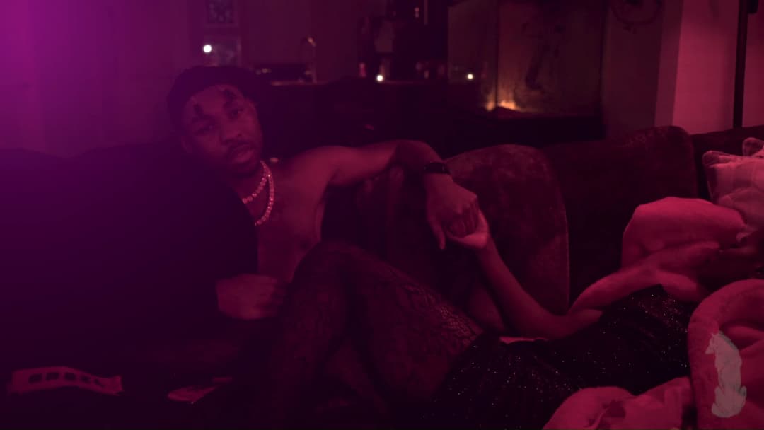 Pain music video still — datamoshed frame 015