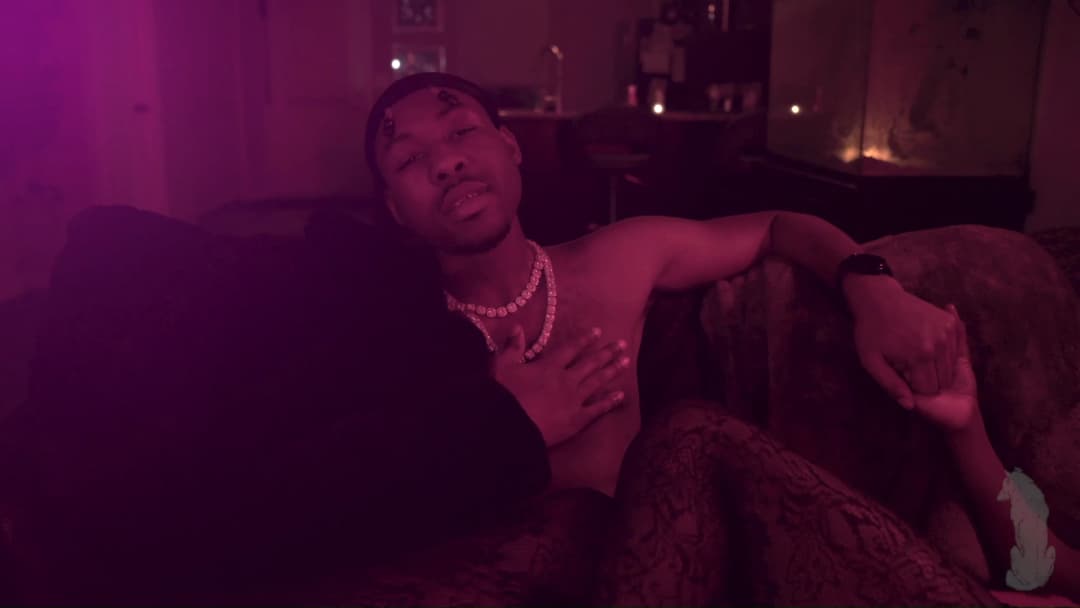 Pain music video still — datamoshed frame 017