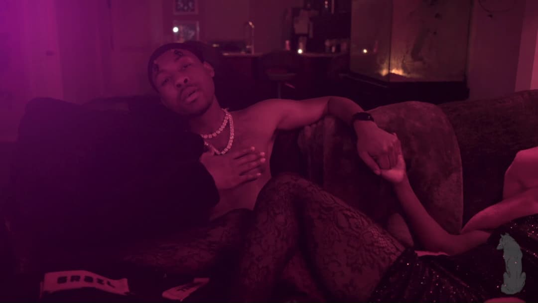 Pain music video still — datamoshed frame 018