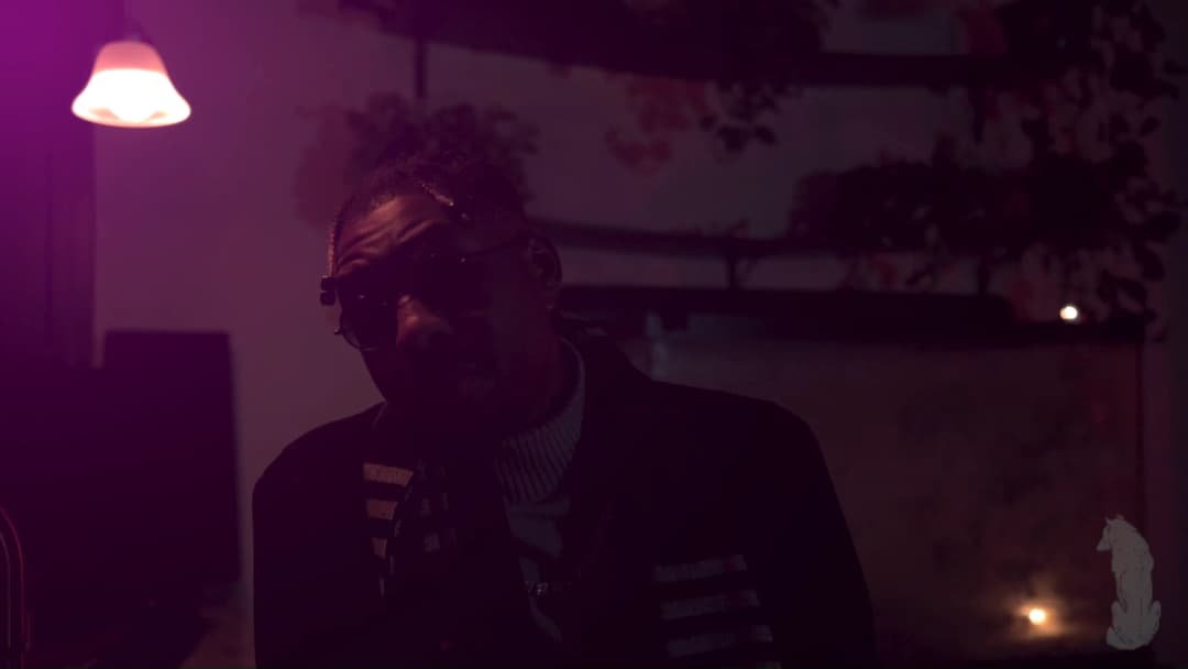 Pain music video still — datamoshed frame 023