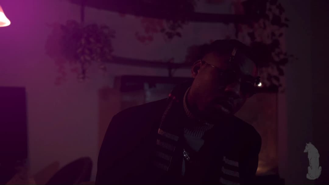 Pain music video still — datamoshed frame 024