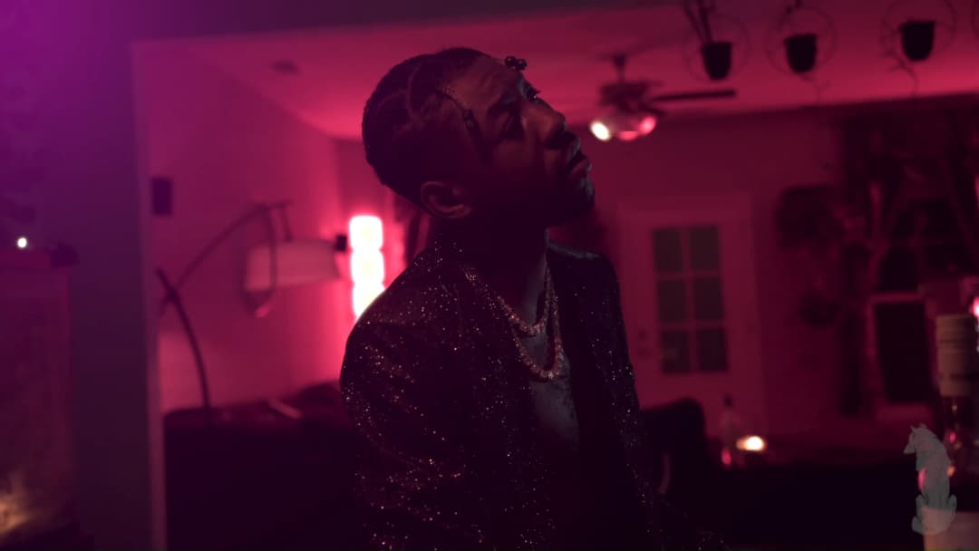 Pain music video still — datamoshed frame 028