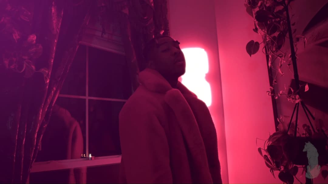 Pain music video still — datamoshed frame 038