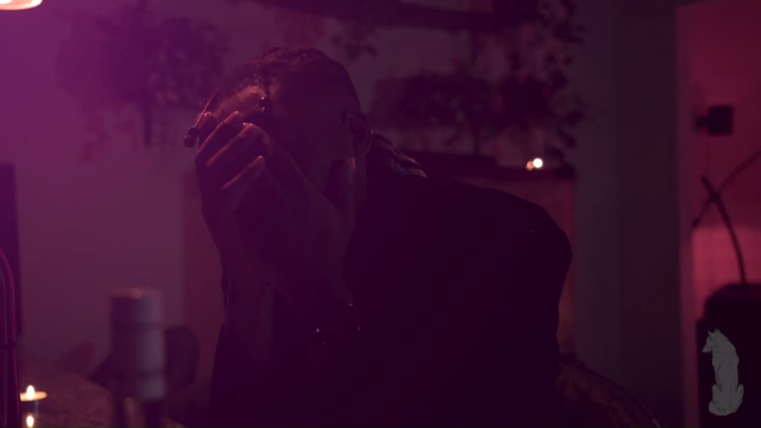 Pain music video still — datamoshed frame 048