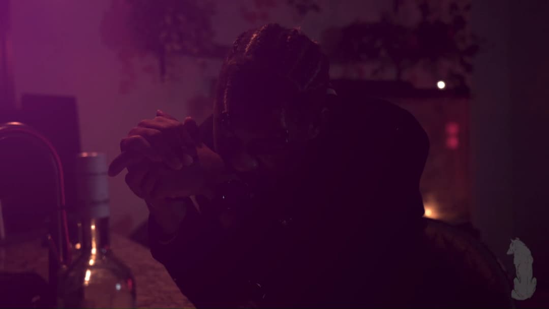 Pain music video still — datamoshed frame 050