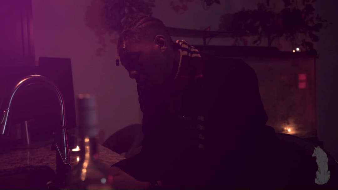 Pain music video still — datamoshed frame 053