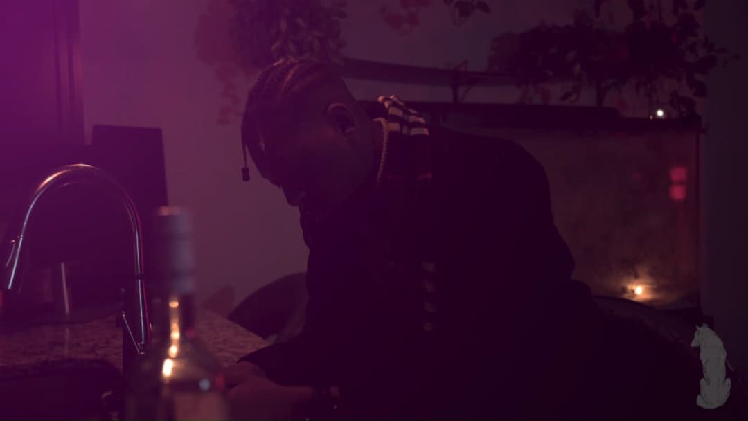 Pain music video still — datamoshed frame 057