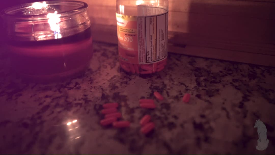 Pain music video still — datamoshed frame 058