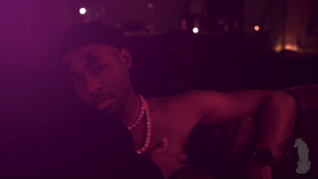 Pain music video still — datamoshed frame 062