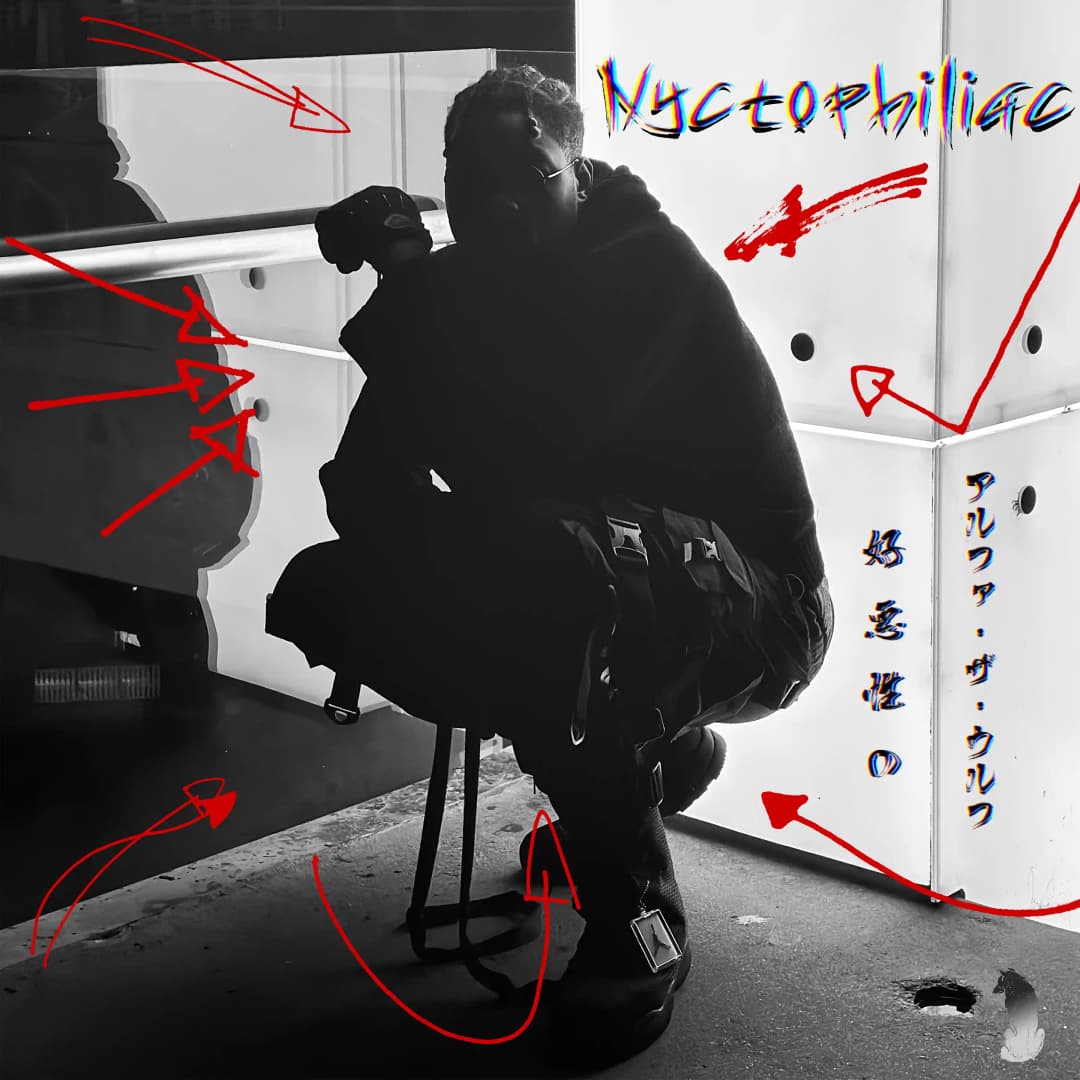 Alpha The Wolf crouching in all-black clothing on a concrete surface, black and white, overlaid with hand-drawn red arrows, scribbles, and the title 'Nyctophiliac' — official album cover