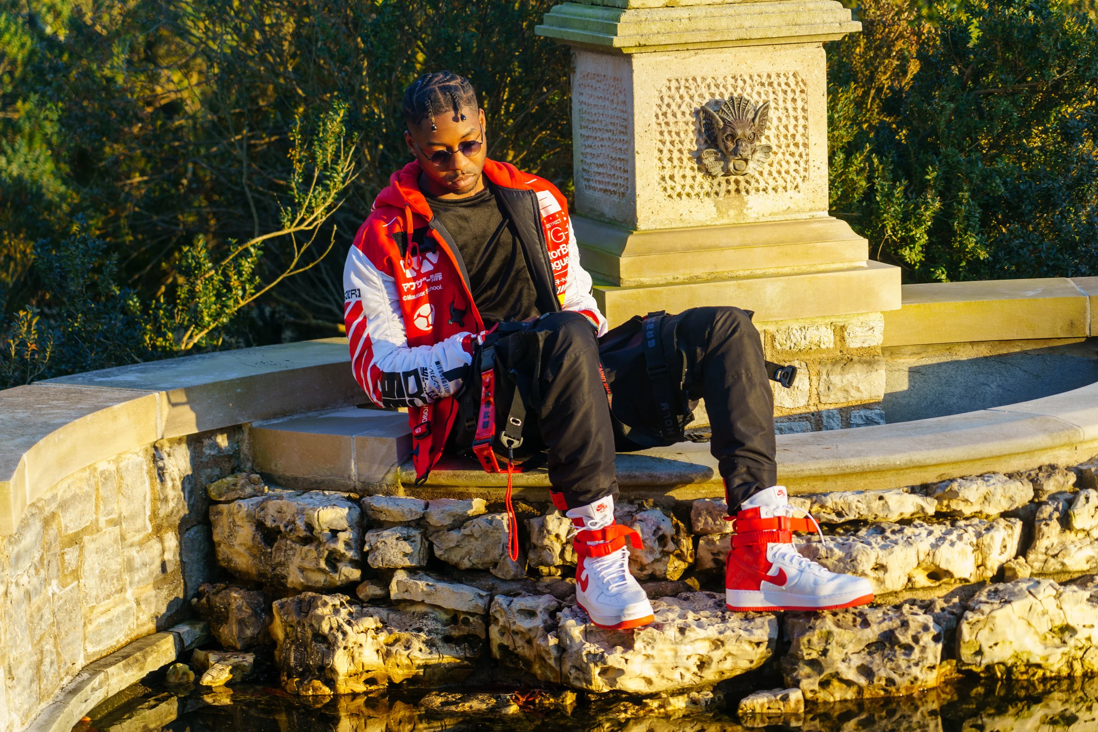 Alpha The Wolf Circles a Cheekwood Reflecting Pool in a Racing Jacket for "Blevins Japanese Garden"