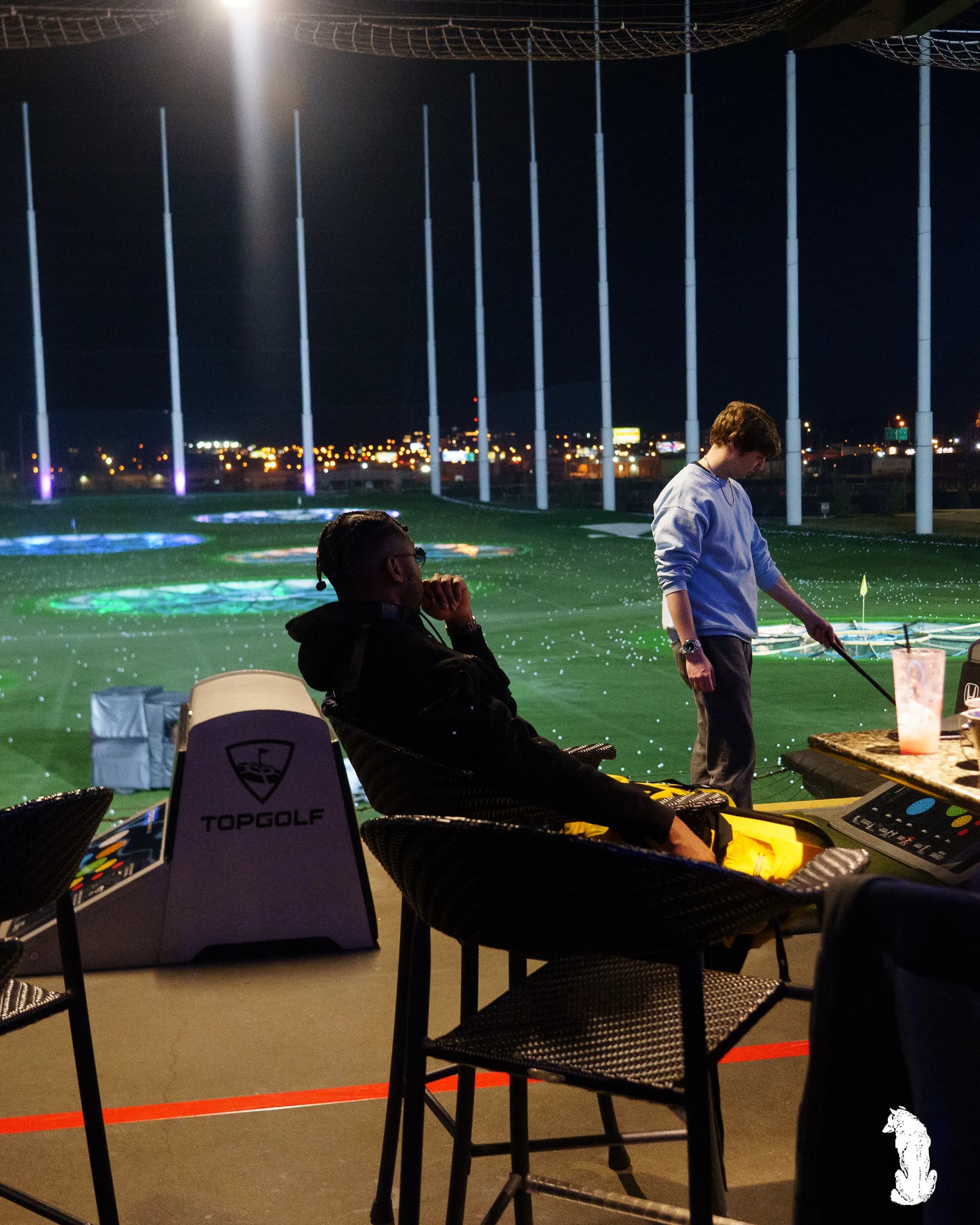 Alpha The Wolf Takes a Topgolf Bay at Night in Head-to-Toe Yellow for "Celebration at Topgolf"