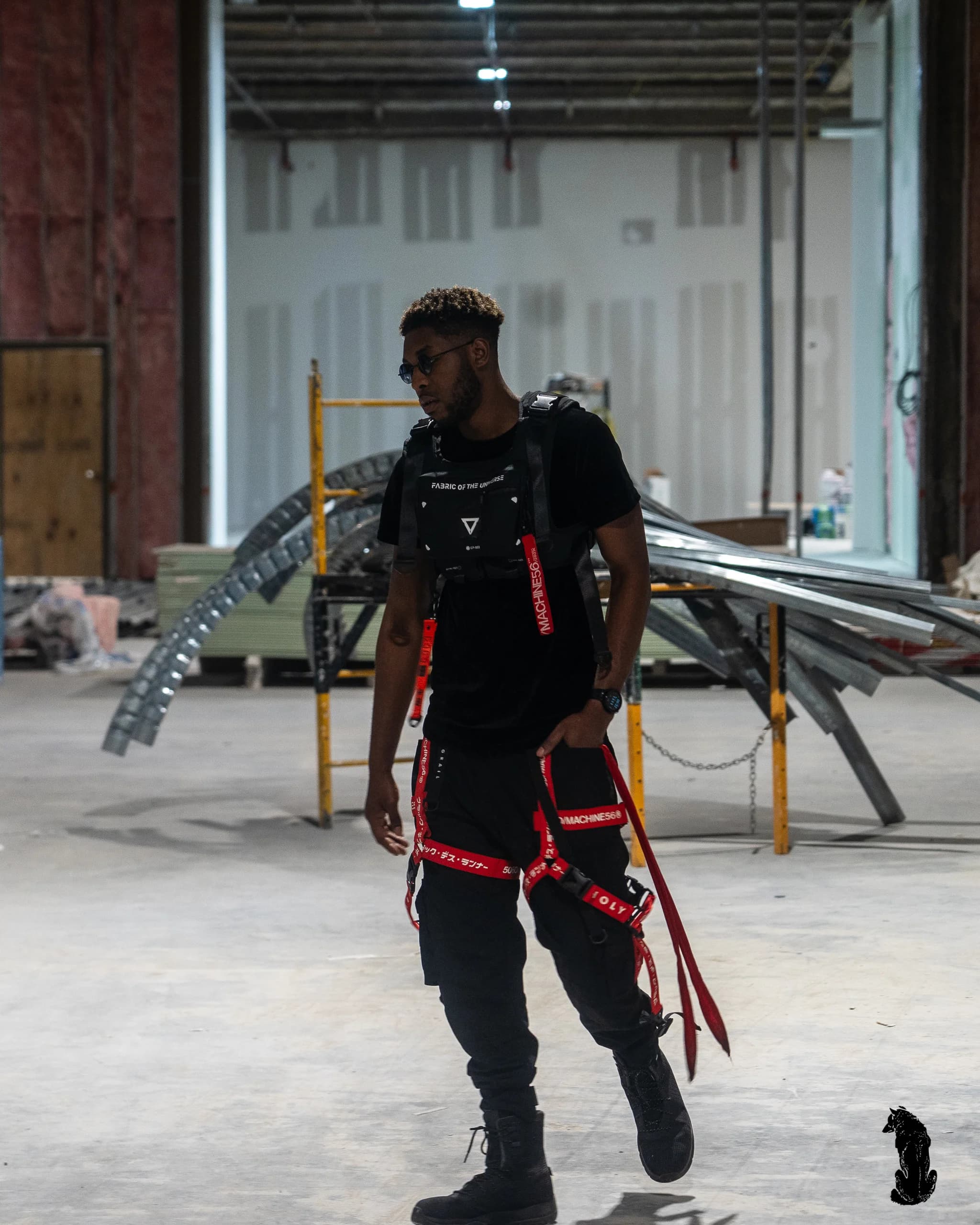 Alpha The Wolf Occupies an Empty Warehouse in a Tactical Rig for "Factory Settings"