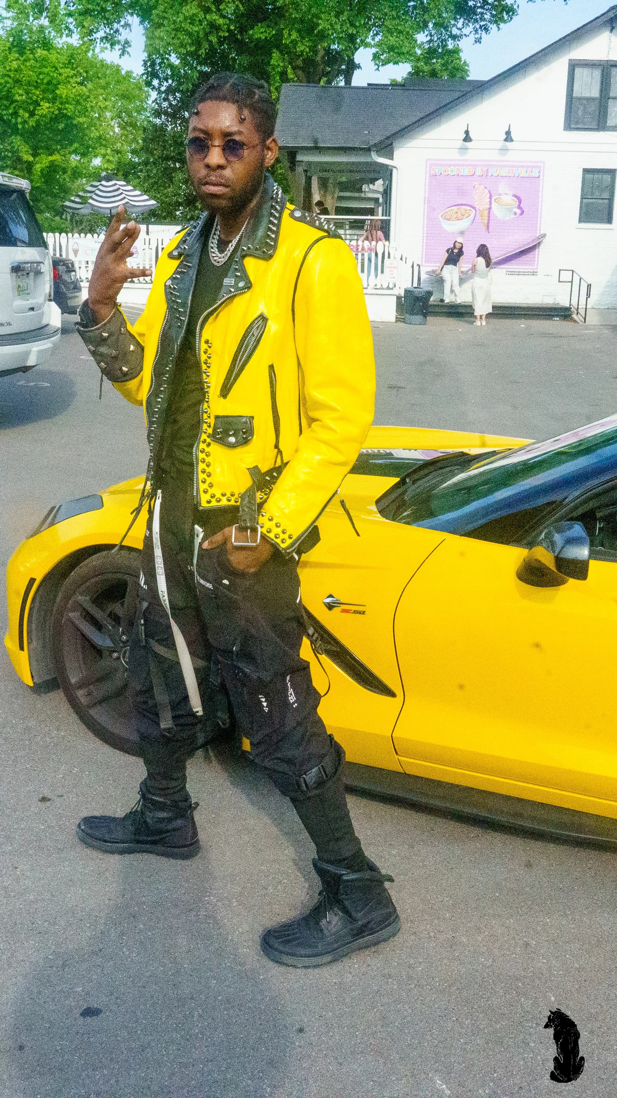 Alpha The Wolf Matches a Yellow Jacket to a Yellow Corvette for "Germantown Market District"