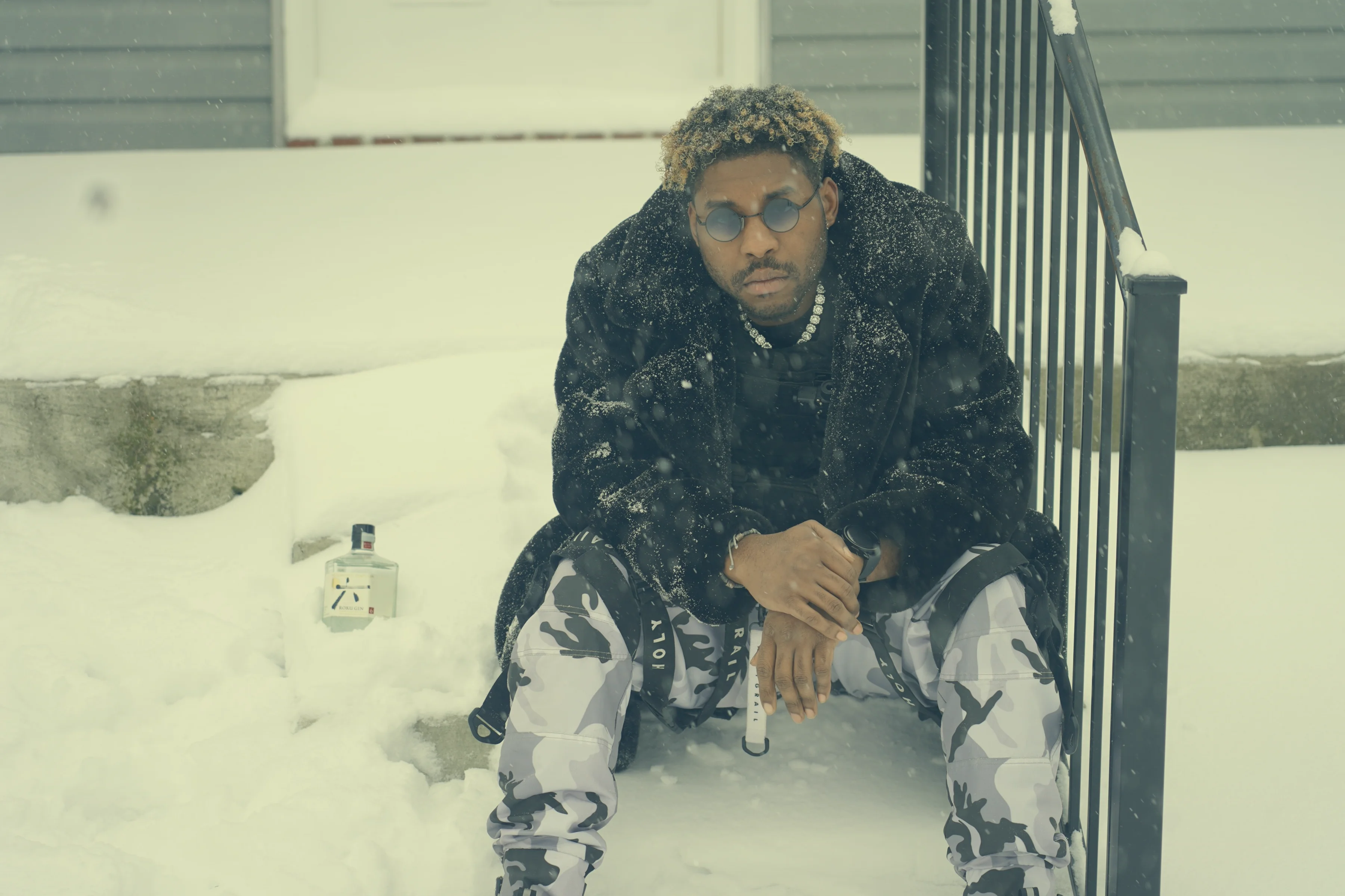 Alpha The Wolf Waits Out a Blizzard in Fur and Camo for "Nashville Blizzard"