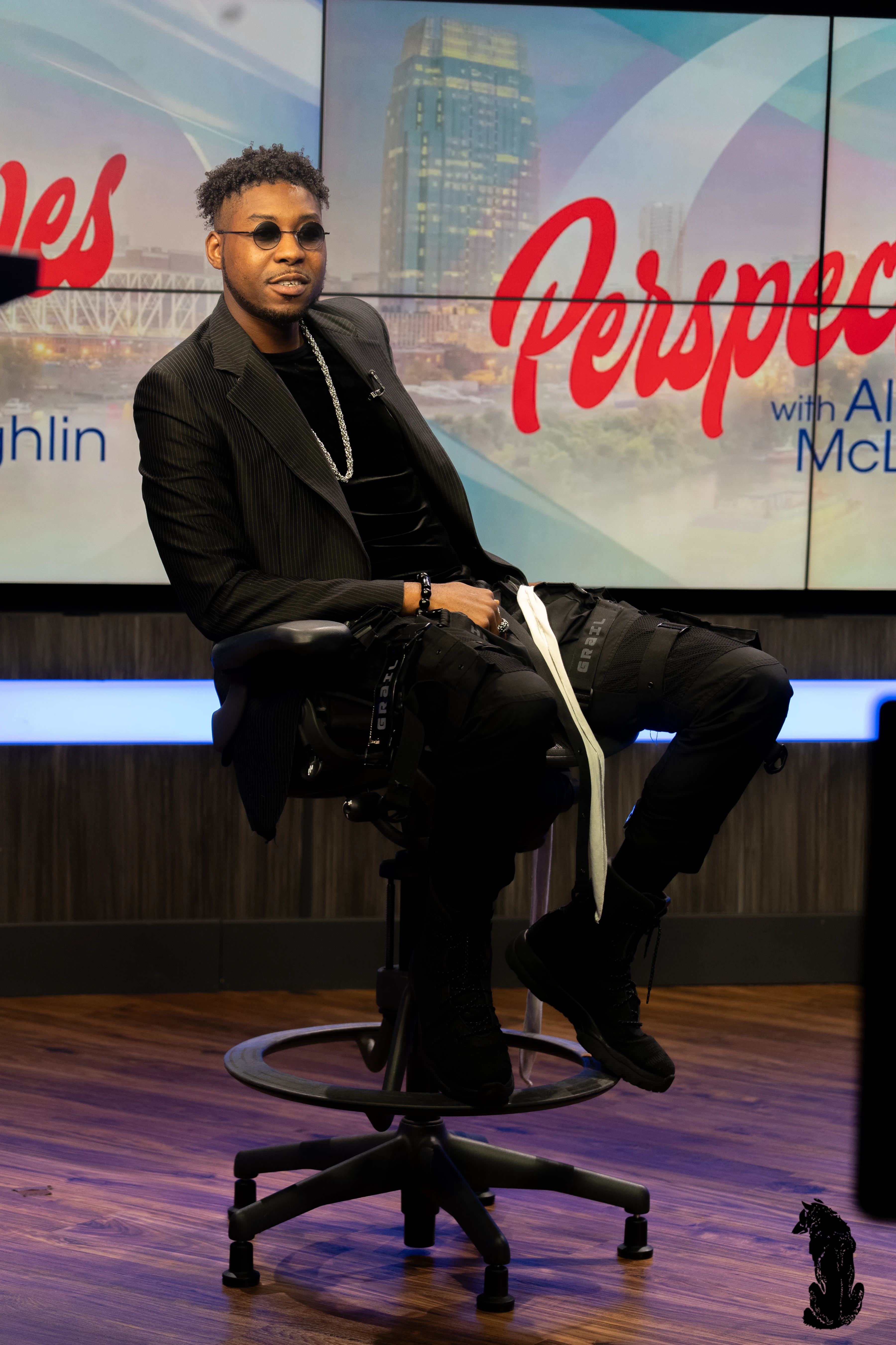 Alpha The Wolf breaking into a broad smile mid-interview on the Perspectives set